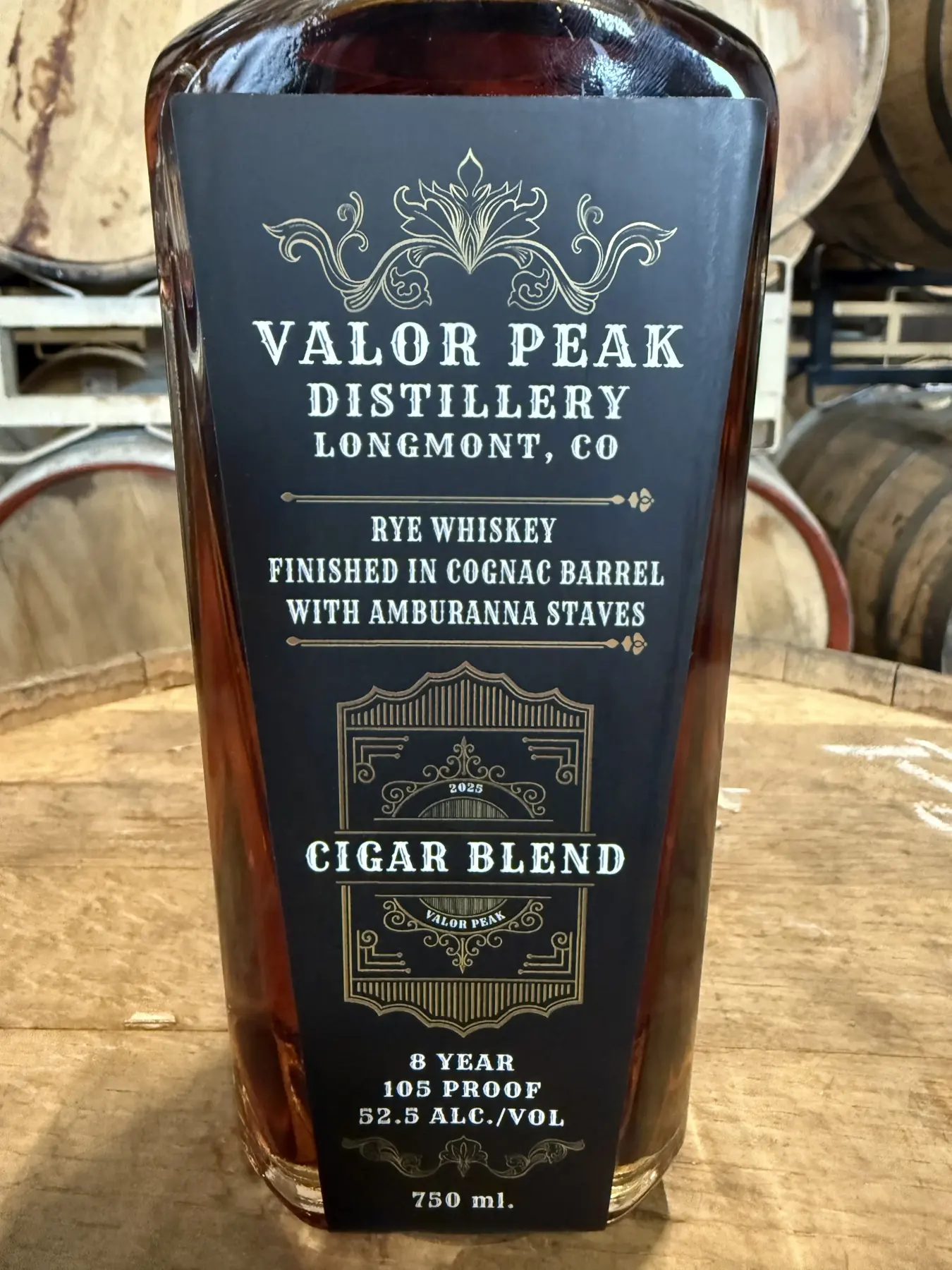 Valor Peak 2025 Cigar Blend Special Release bottle photographed in the Valor Peak barrel room