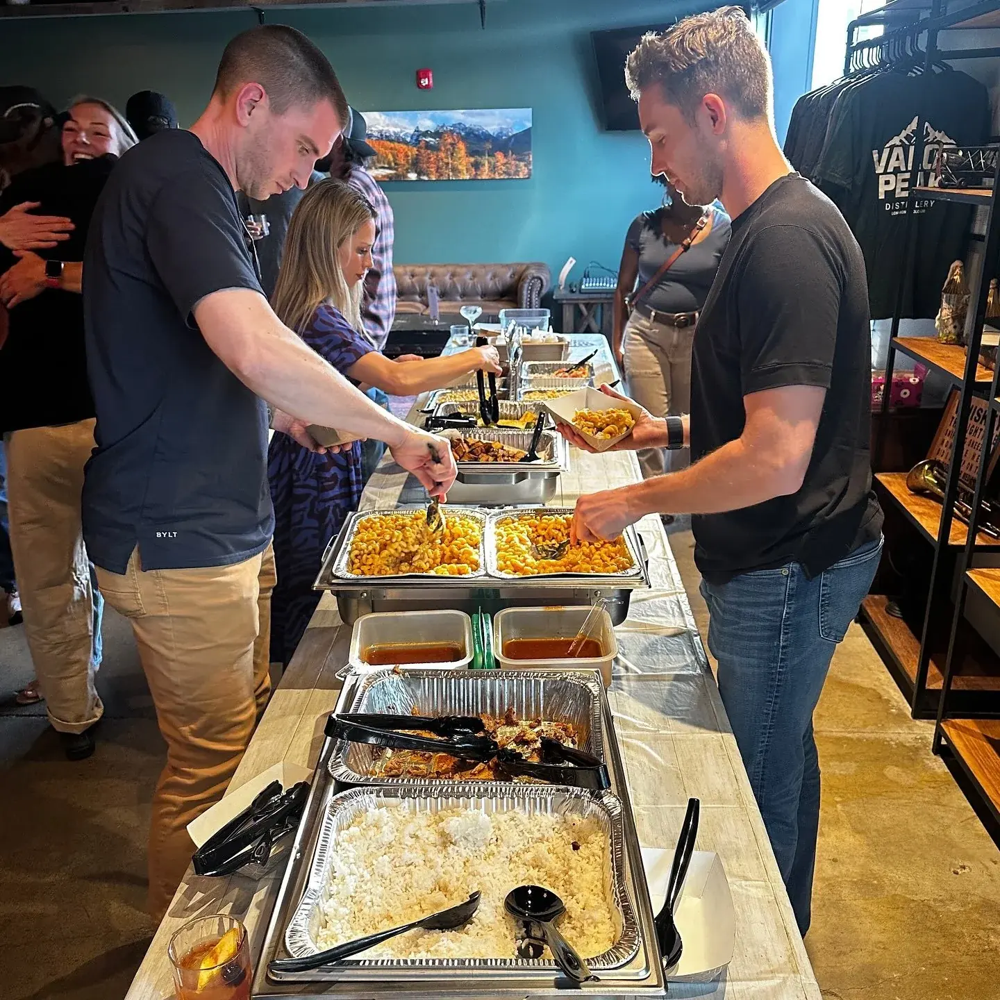Guests sharing food and conversation at a Valor Peak community event