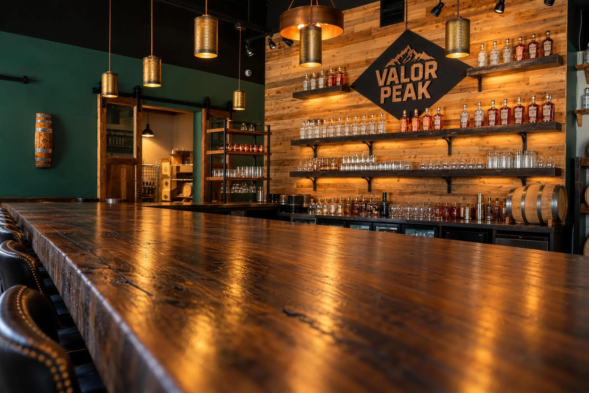The Valor Peak tasting room bar in Longmont with the diamond Valor Peak sign