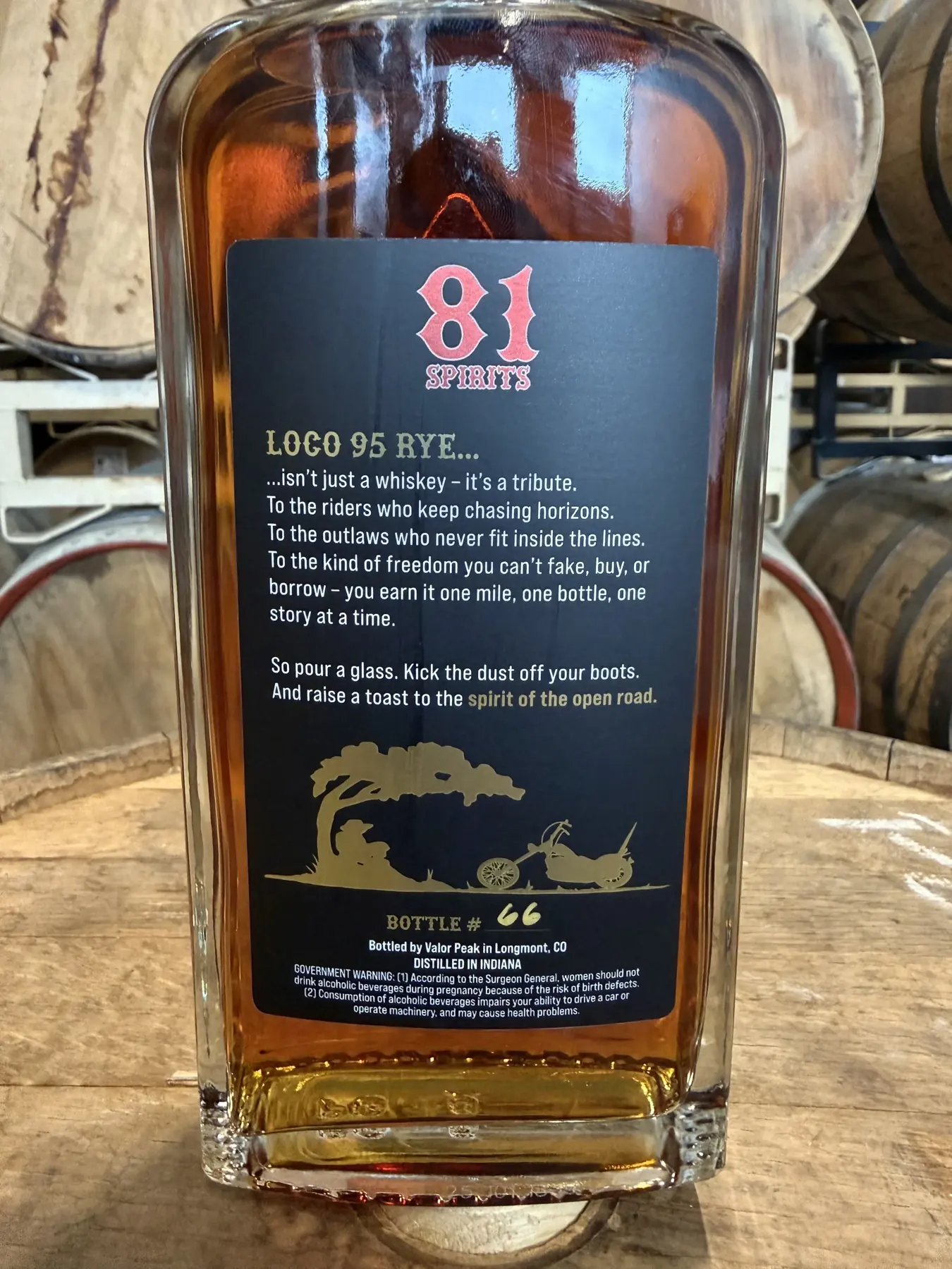 81 Spirits Contract Distillation Partner bottle photographed in the Valor Peak barrel room