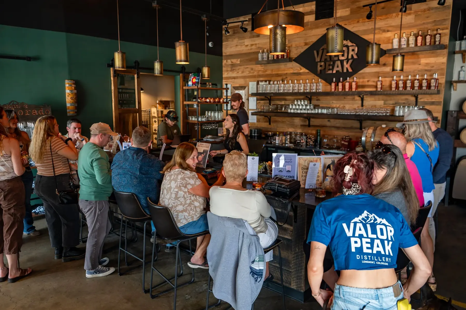 Friends gathered at the Valor Peak tasting room bar